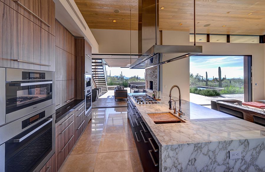 Marble kitchen island and wooden shelves for the contemporary kitchen