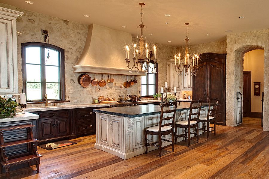 Mediterranean kitchen with an exquisite stone wall backdrop [Design: Pyramid Builders]