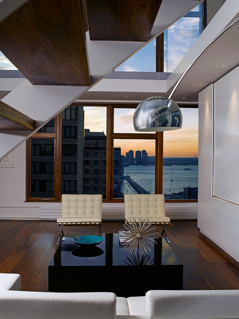 Midcentury modern icons combined with sleek black coffee table [Design: Zakrzewski + Hyde Architects]