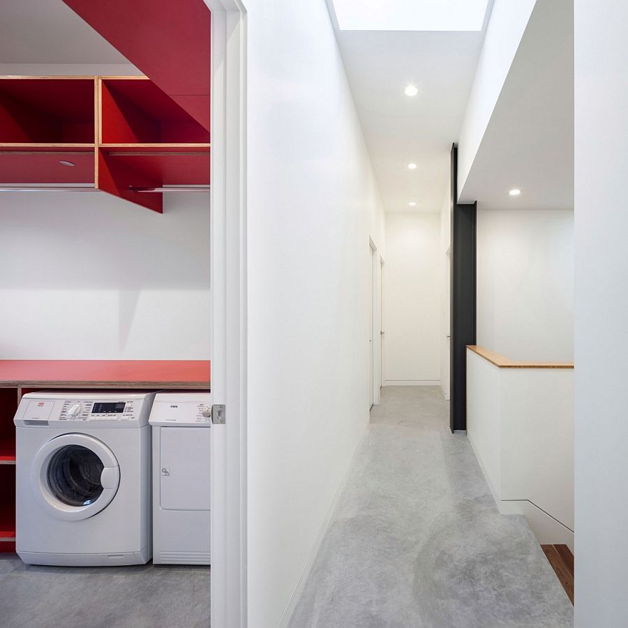 Modern minimal laundry room with a dash of red