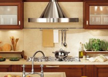 Multiple-wall-mounted-cabinets-add-to-the-visual-symmetry-of-the-kitchen-217x155