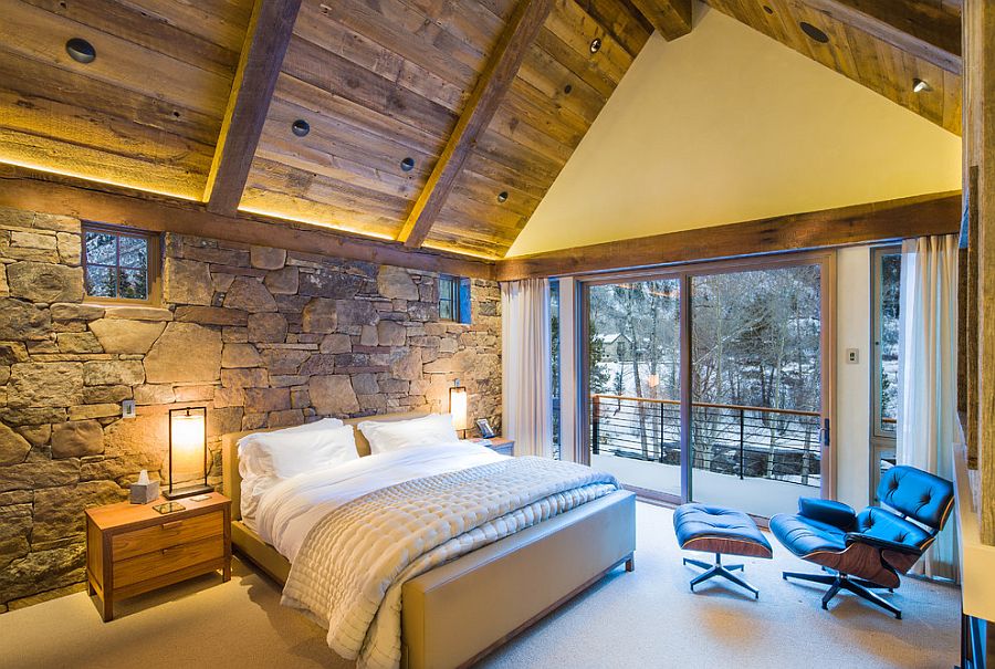 Natural farmer's field stone stacked beautifully to create a wonderful bedroom accent wall [Design: Zone 4 Architects]