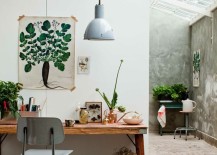 Nature-inspired-painting-hung-above-a-desk-in-a-greenhouse-217x155