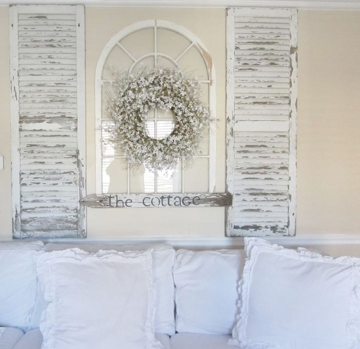 Old shutters in cottage living room with a shabby chic look