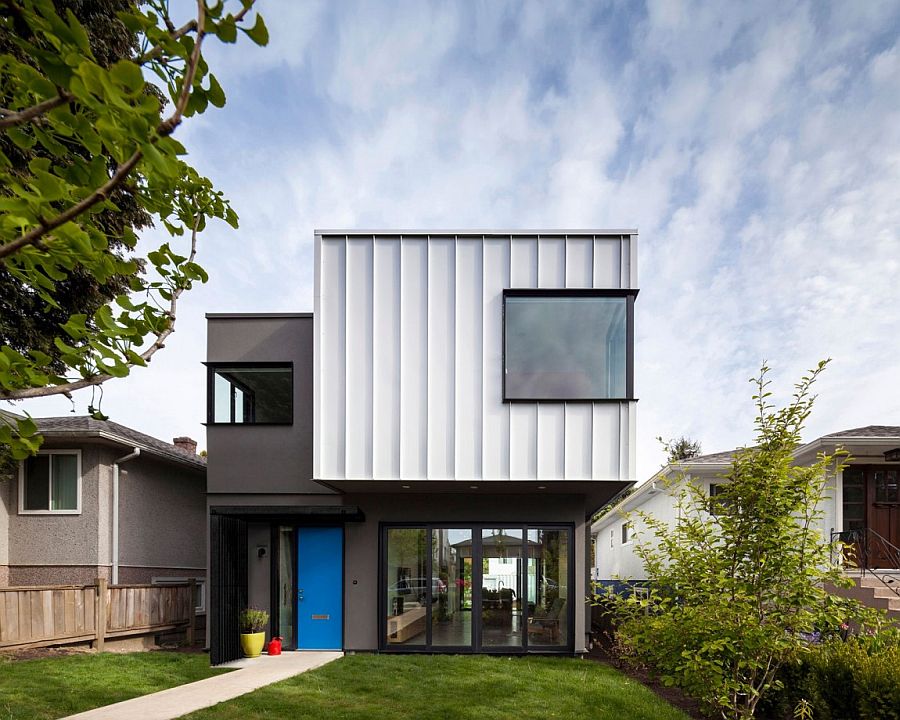 Painted front door in blue adds color to the gray and white exterior of the Vancouver home