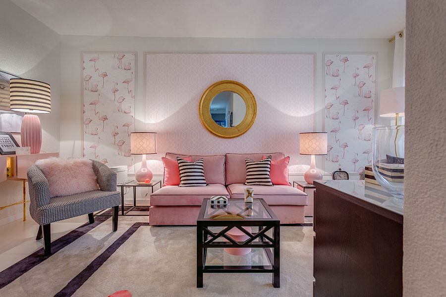 Plush couch, lamps and fuzzy pillow add an undeniable pink hue to the cozy living room