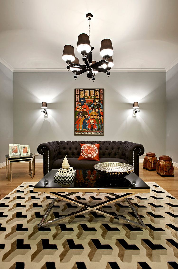 Polished chrome frame and black glass coffee table for the glam living room [Design: Sense of Style]