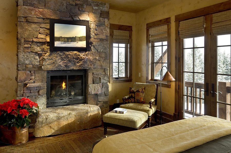 Rustic bedroom turns the stone wall into a lovely focal point [From: Design Associates]