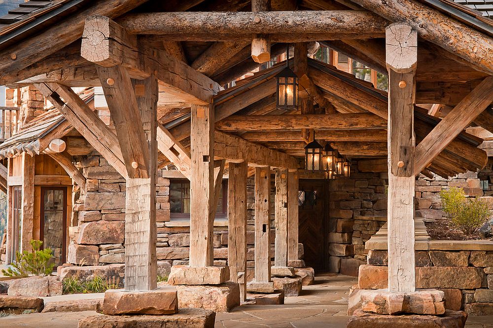 Rustic entry with lantern lighting is an absolute dream!