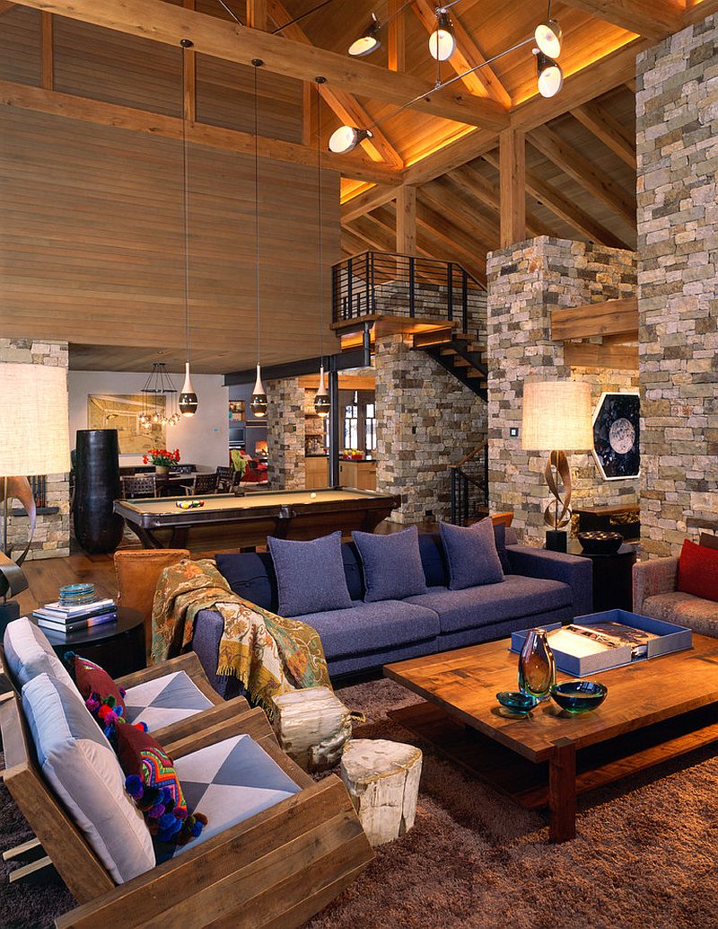 Rustic living room with stone walls and high ceiling