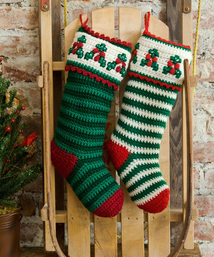 Sled leaning against wall with Christmas stockings