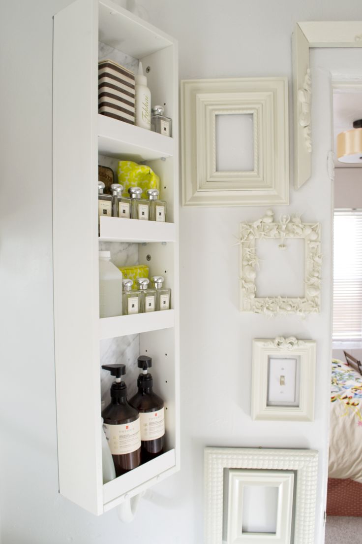 Small shelving piece installed on bathroom wall