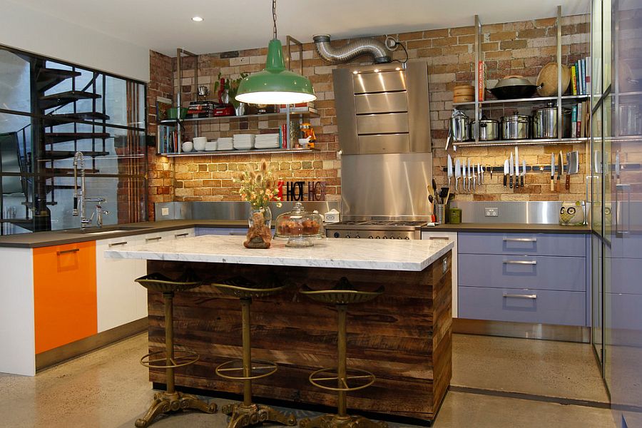 Splashes of orange and purple enliven the modest kitchen