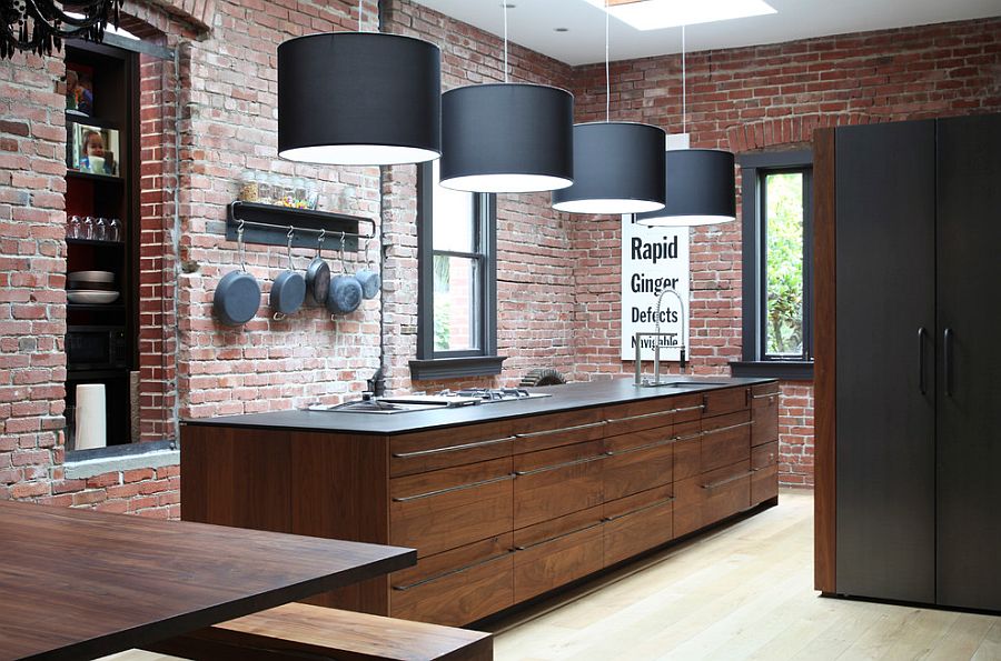 Striking pendant lighting and brick walls create a great fusion between contemporary and industrial styles
