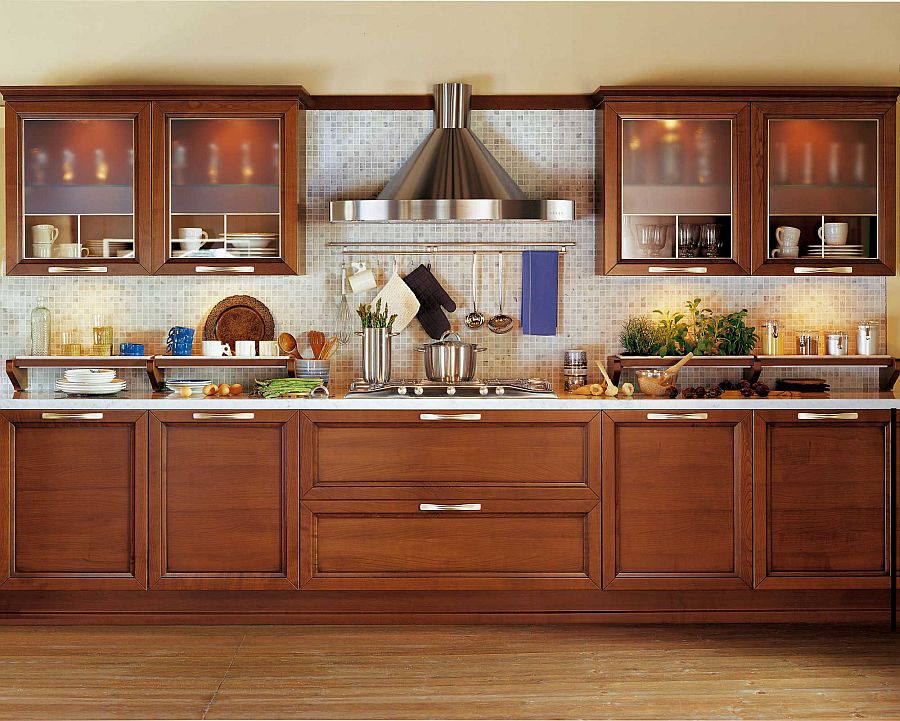 Stylish kitchen with stainless steel hood and Carrara marble backsplash