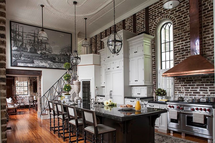 Sweeping Victorian kitchen with high ceiling, brick wall backdrop and an air of dramatic flair