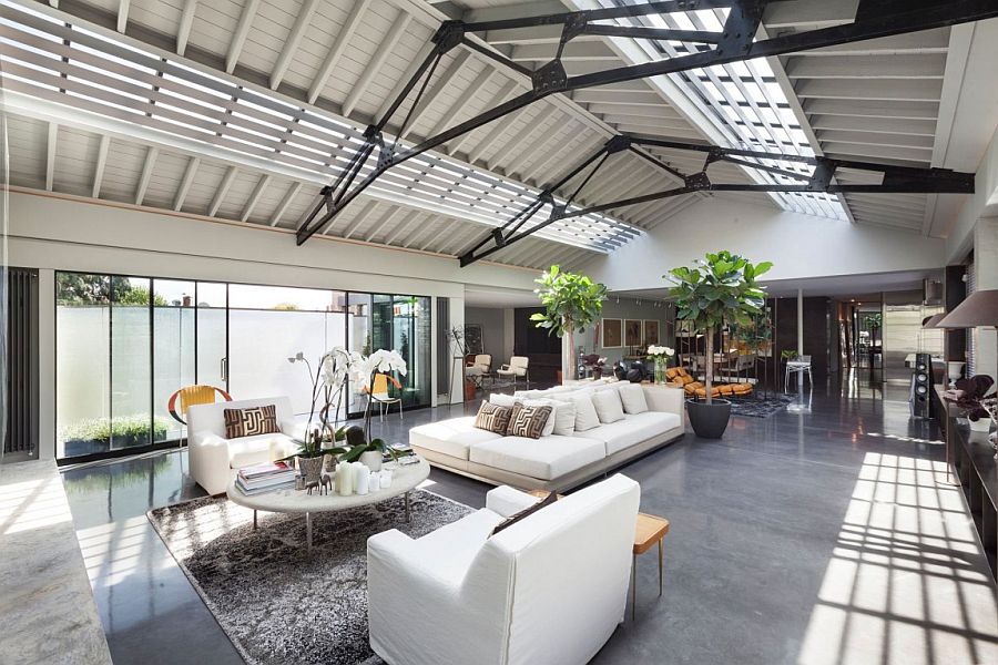 Sweeping inetriors of the loft-style lateral penthouse in London with industrial and art deco vibe