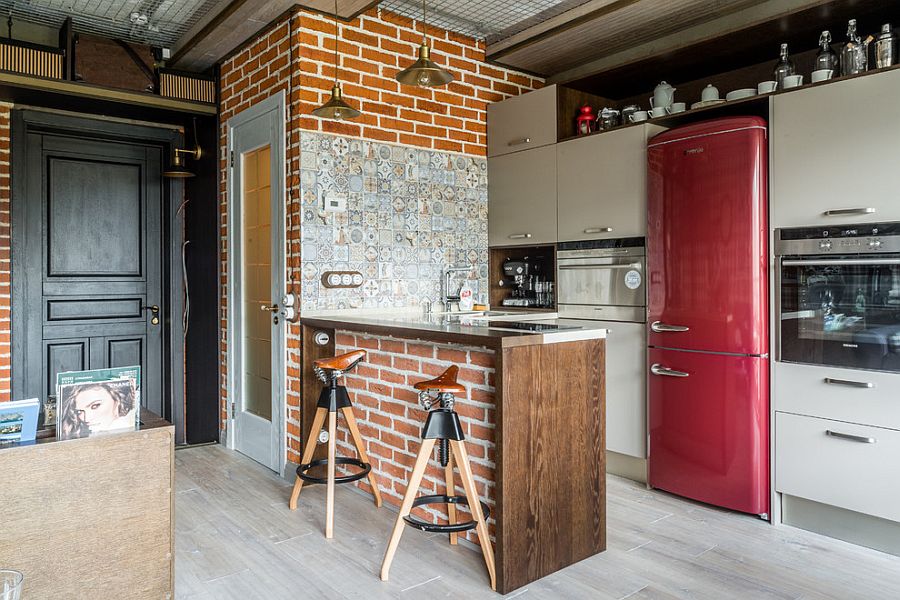 Kitchen In A Loft Style With Concrete And Brick Walls And Tiles A