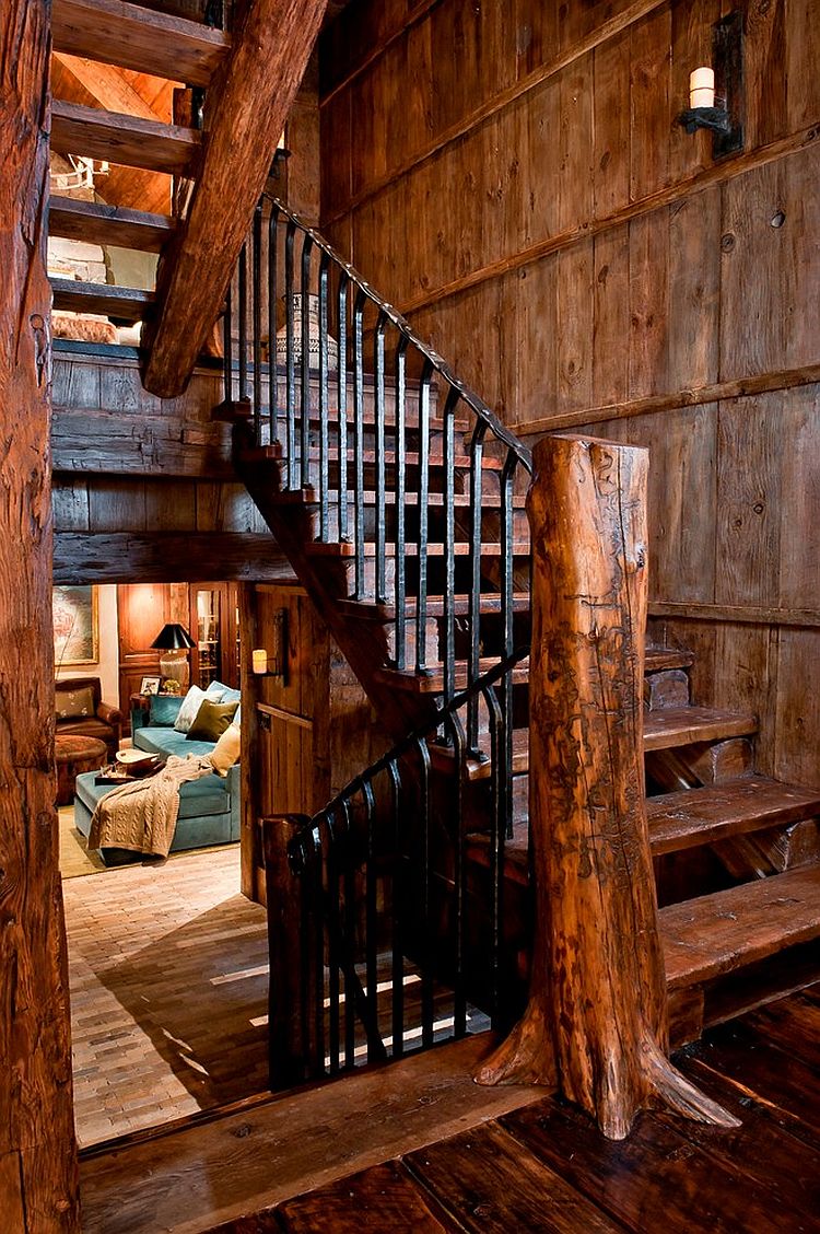 Treet trunk turned into a newel post adds to the rustic character of the staircase