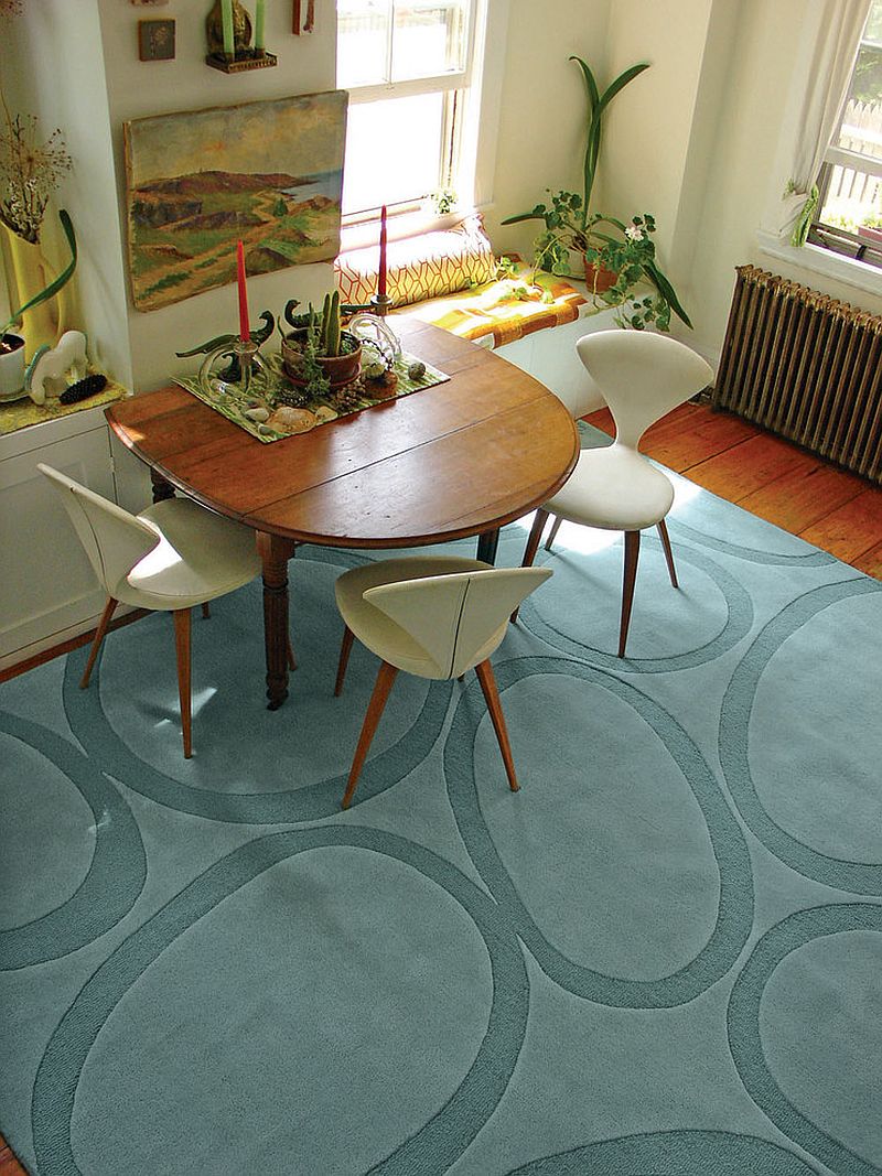 Unconventional arrangement in the dining room lets the rug shine through! [Design: angela adams]