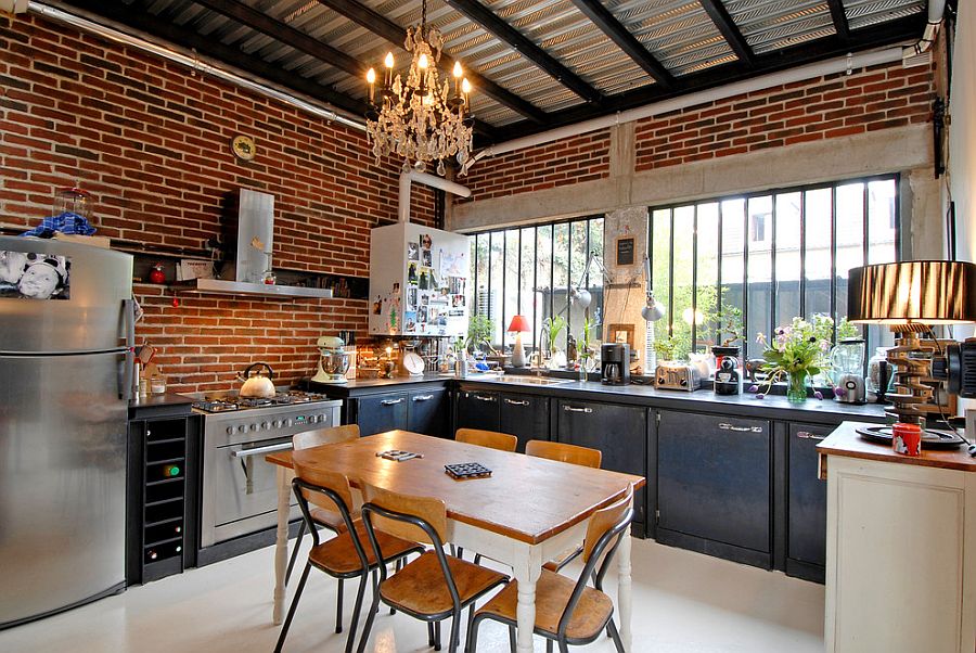 Kitchen In A Loft Style With Concrete And Brick Walls And Tiles A