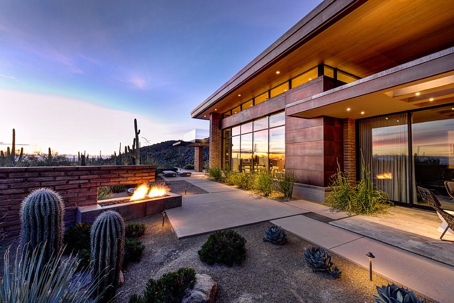 Use of adobe walls allows the home to blend in with the desert landscape