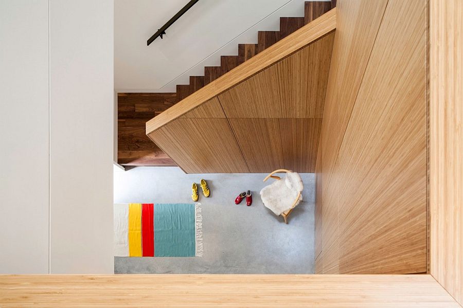 View of the custom wooden staircase from the top floor