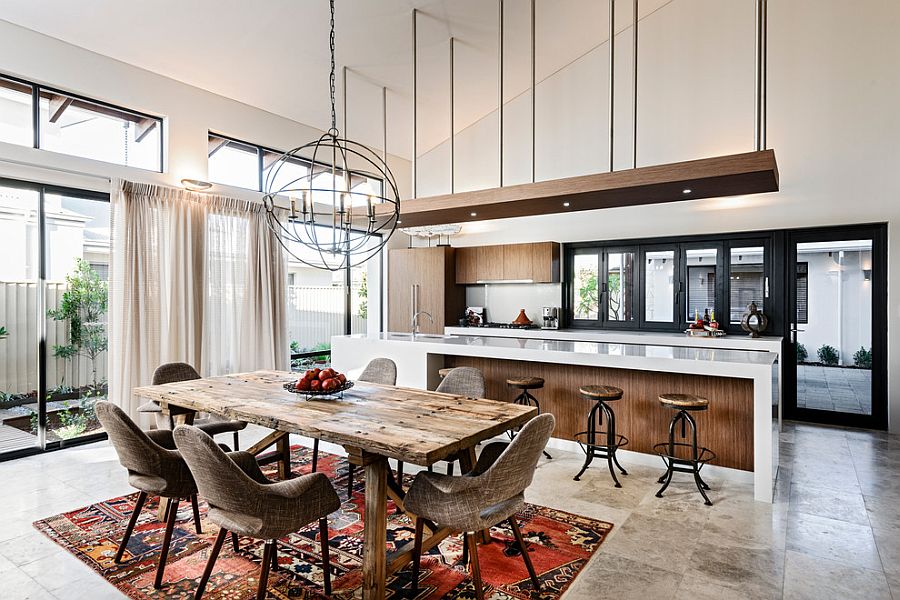 Vintage patchwork rug for the dining space in open plan living area [Design: Jodie Cooper Design]