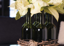 White-poinsettias-displayed-in-wine-bottles-217x155