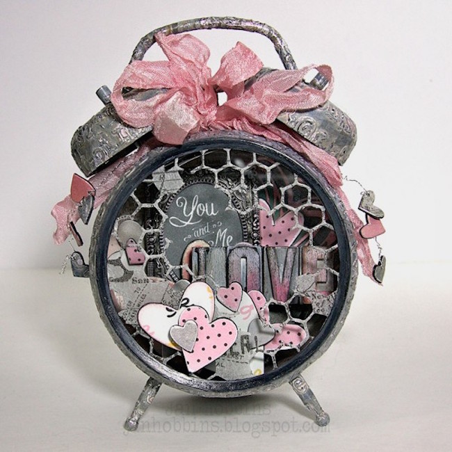 Altered alarm clock with a gray and pink love theme