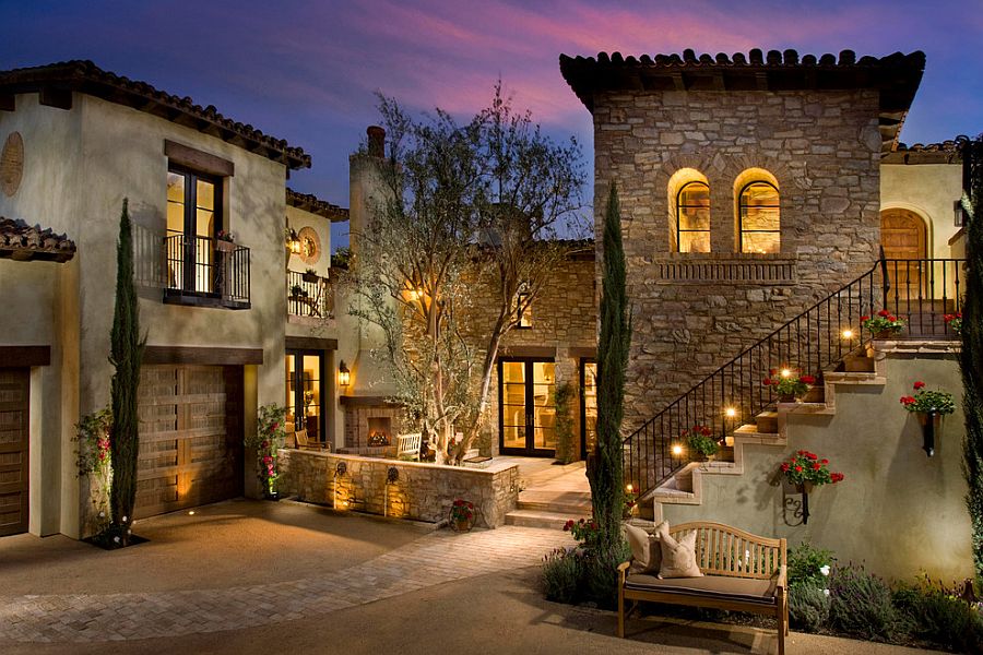 Beautiful Mediterranean home with gorgeous lighting and a series of balconies [Design: Maui Windows & Doors]