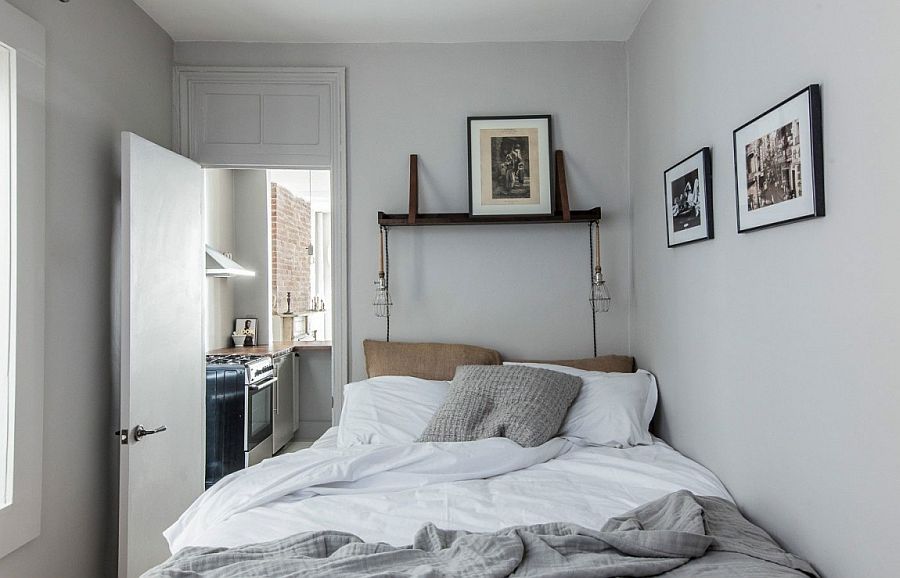 Black and white prints inside the small bedroom accentuate the monochromatic look