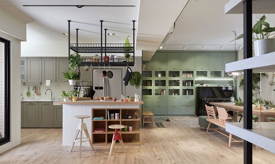 Black steel storage racks above the central kitchen island