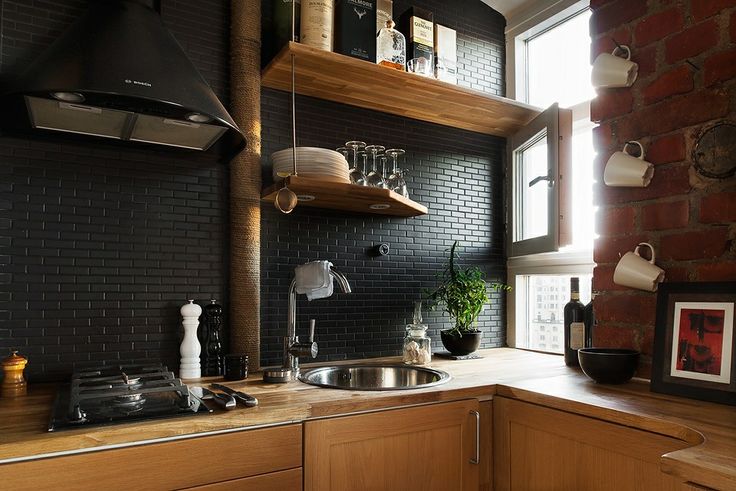 Black subway tile backsplash in a modern kitchen