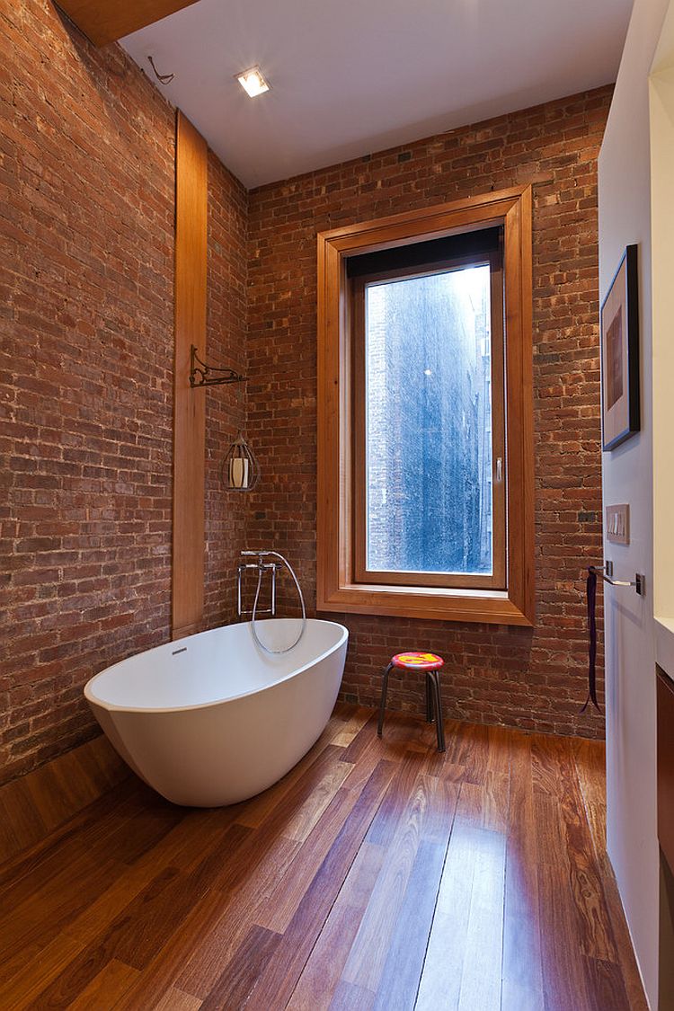 Brick and wood create an elegant industrial bathroom