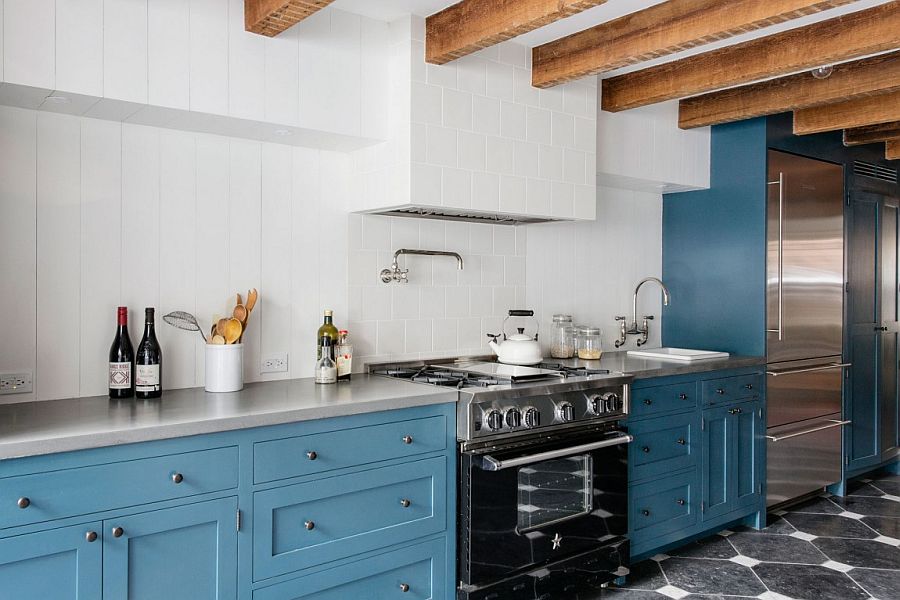 Cabinets in blue add color to the spacious kitchen