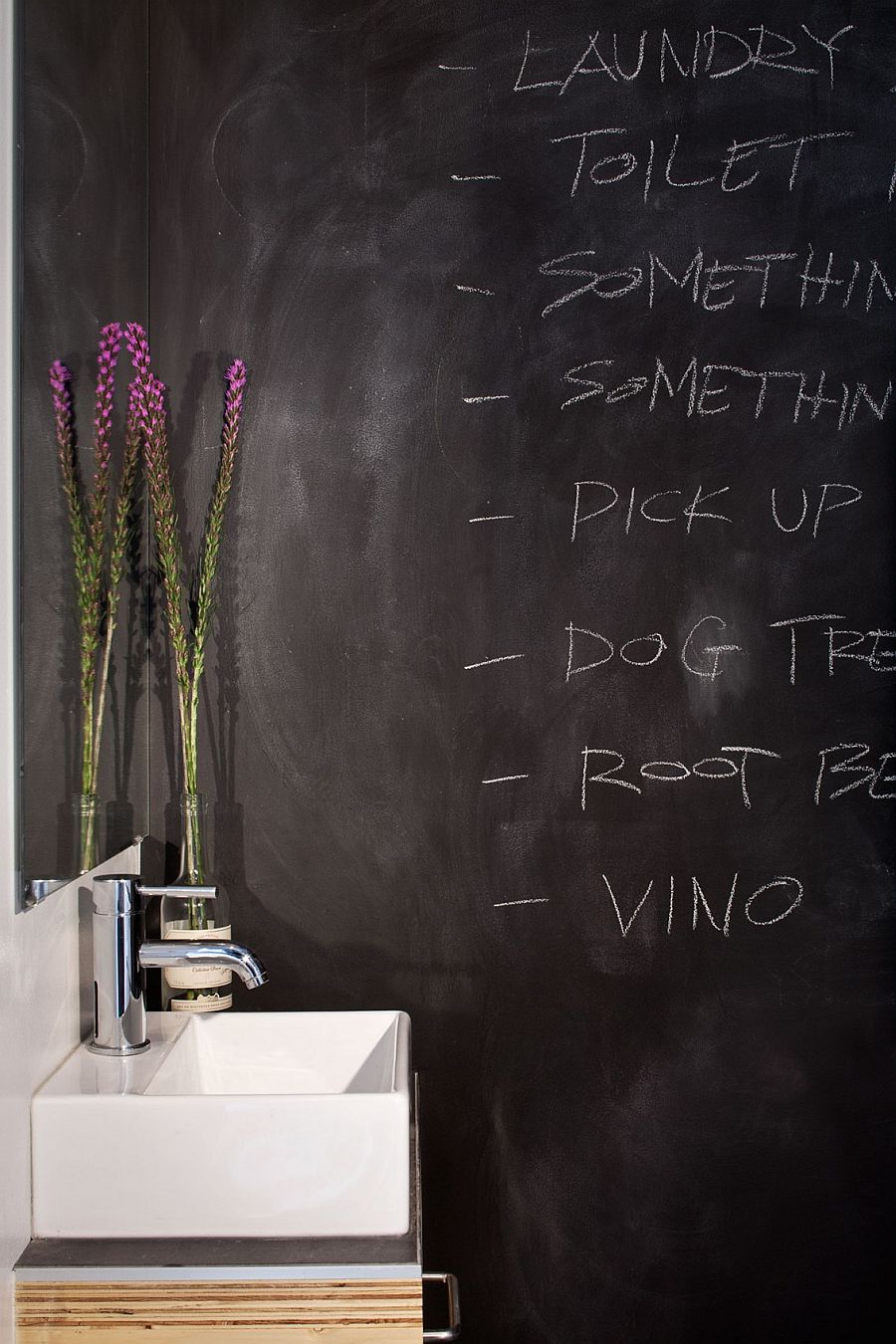 Chalkboard walls in the bathroom make for a fun and dynamic surface