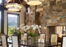 Classy contemporary dining room with stone fireplace 217x155 Fitting in with Every Style: Gorgeous Dining Rooms with Stone Walls
