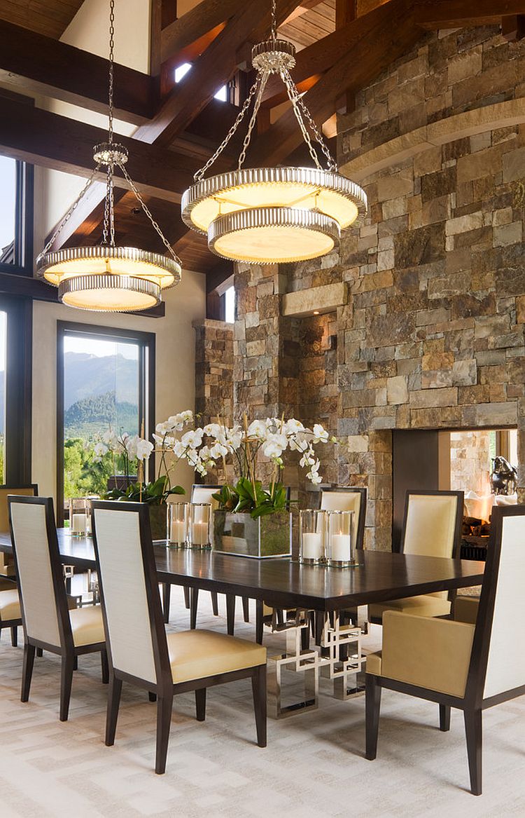 Classy contemporary dining room with stone fireplace [Design: Charles Cunniffe Architects Aspen]