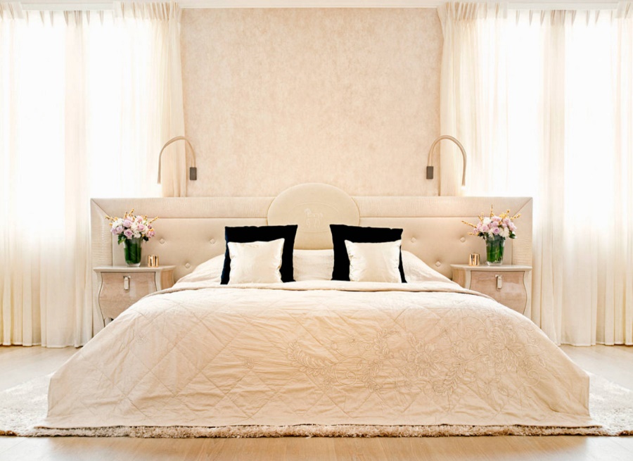 Cream draperies in an elegant bedroom