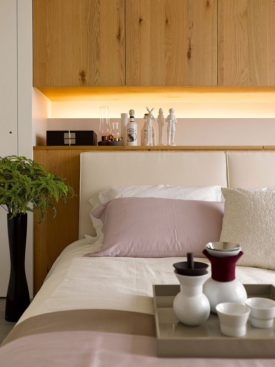 Custom headboard wall with built-in shelf and lovely lighting