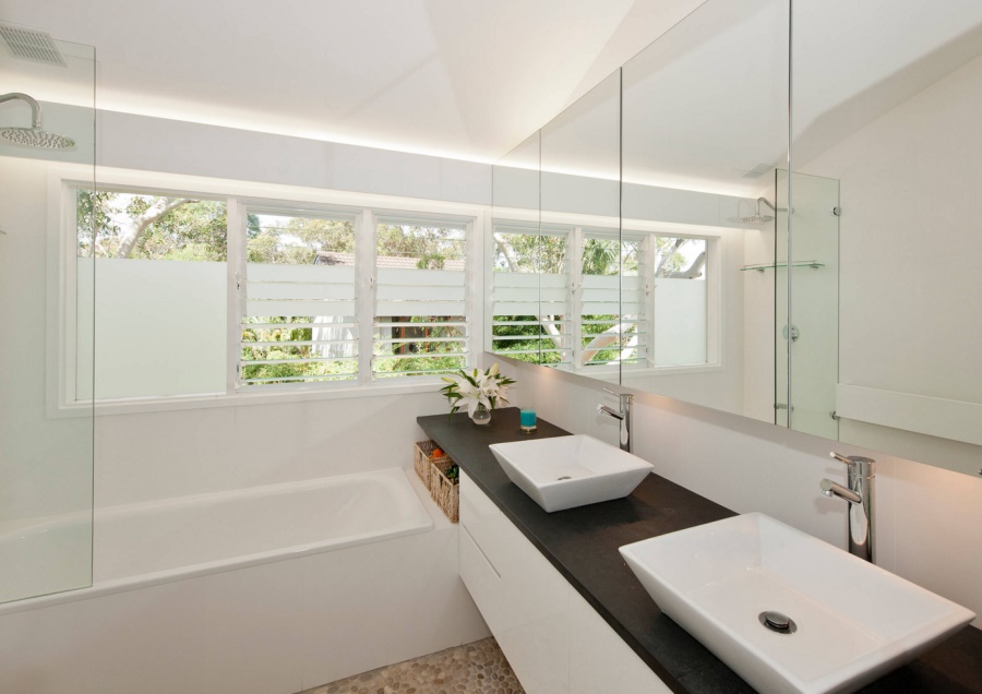 Custom-made vanity in a crisp, modern bathroom