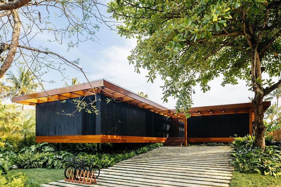 Dark exterior and unique roof of RT House conceal its more expansive interior