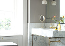 Delicate pendant lighting in a powder room with marble detailing 217x155 Bring Living Room Style to Your Powder Room