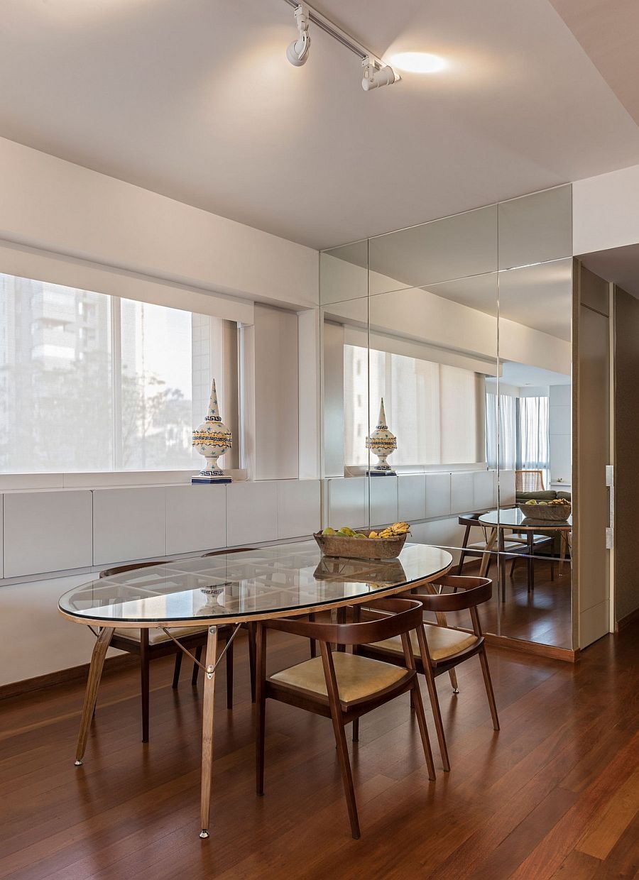 Dining area with mirrored cabinets and contemporary vibe