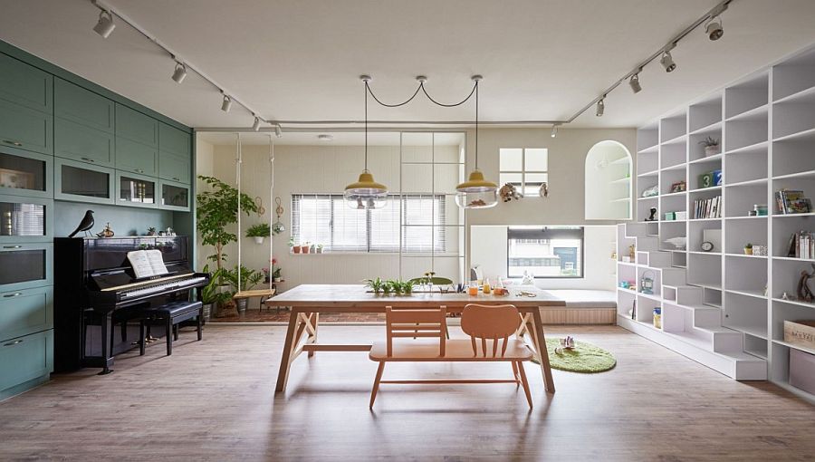 Dining room and kids' playroom with swing and ample storage space