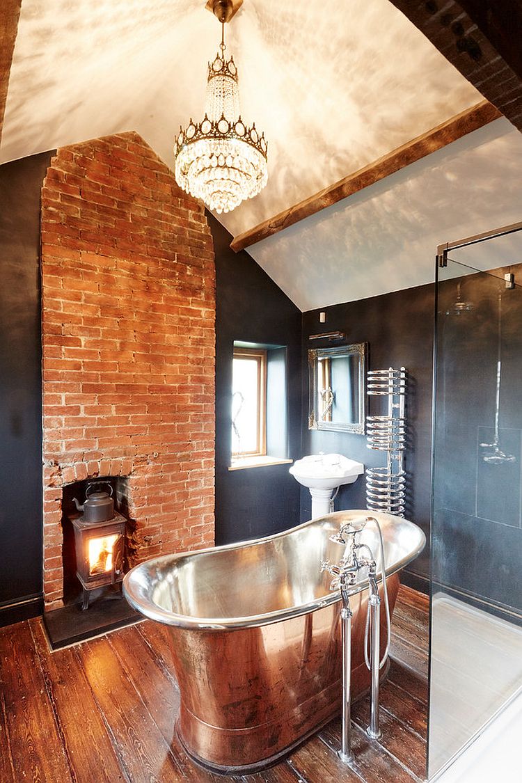 Fireplace and lighting elevate the style quotient of this gorgeous farmhouse bathroom [Design: Hart Design And Construction]