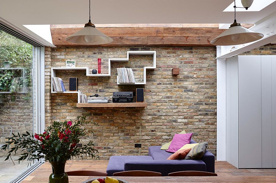 Floating modern and wooden shelf in the living room with brick wall