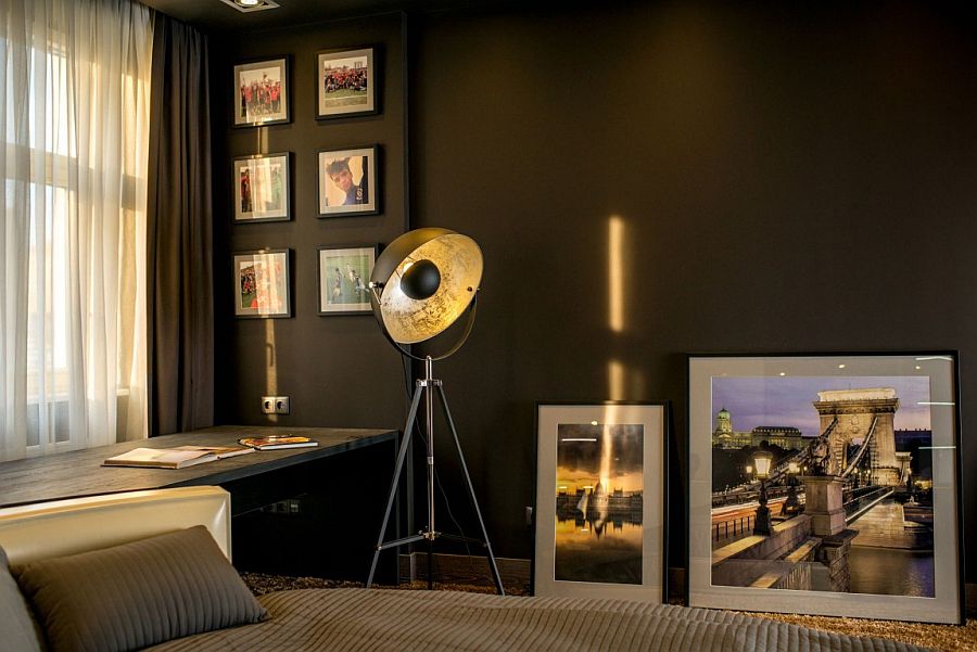 Framed photographs add to the sophisticated atmosphere inside the apartment