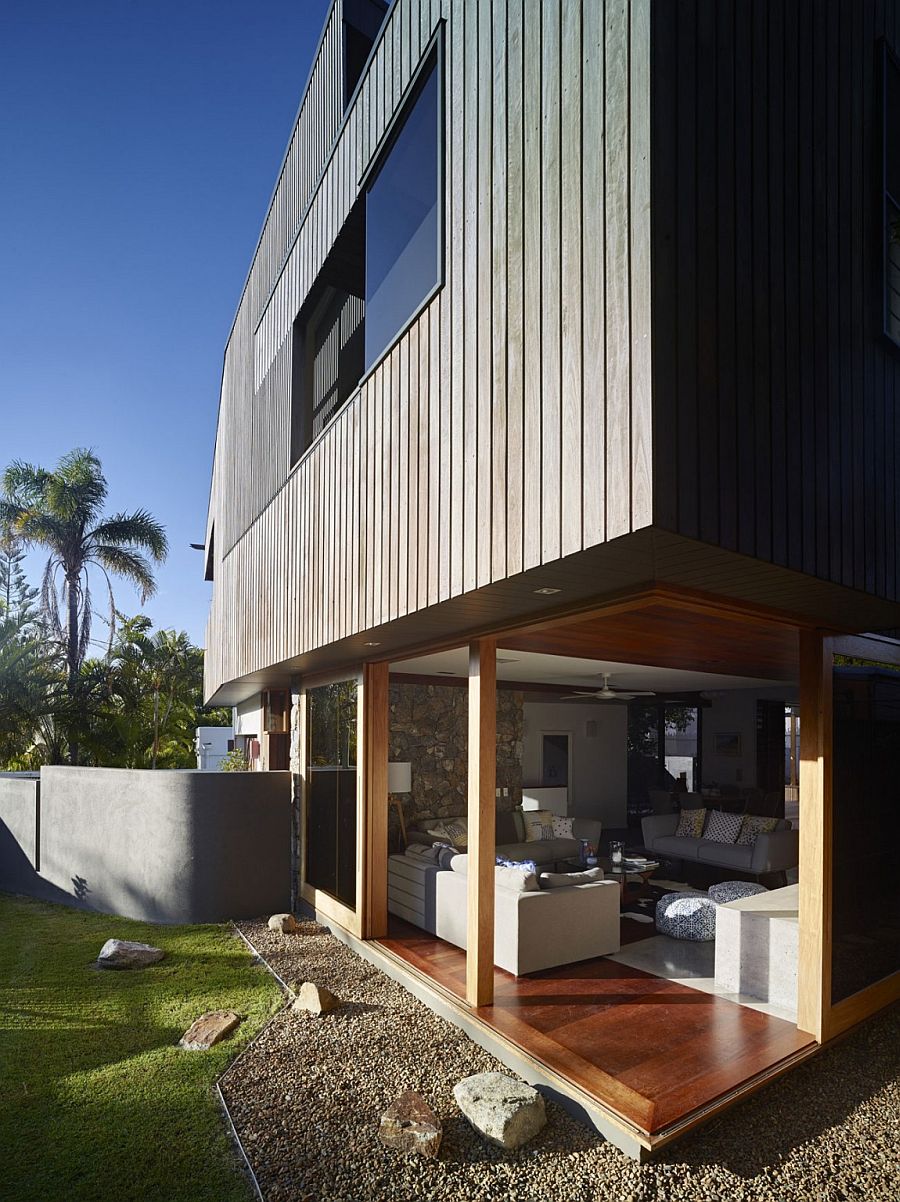 Framed sliding glass doors open up the living room to the outdoors